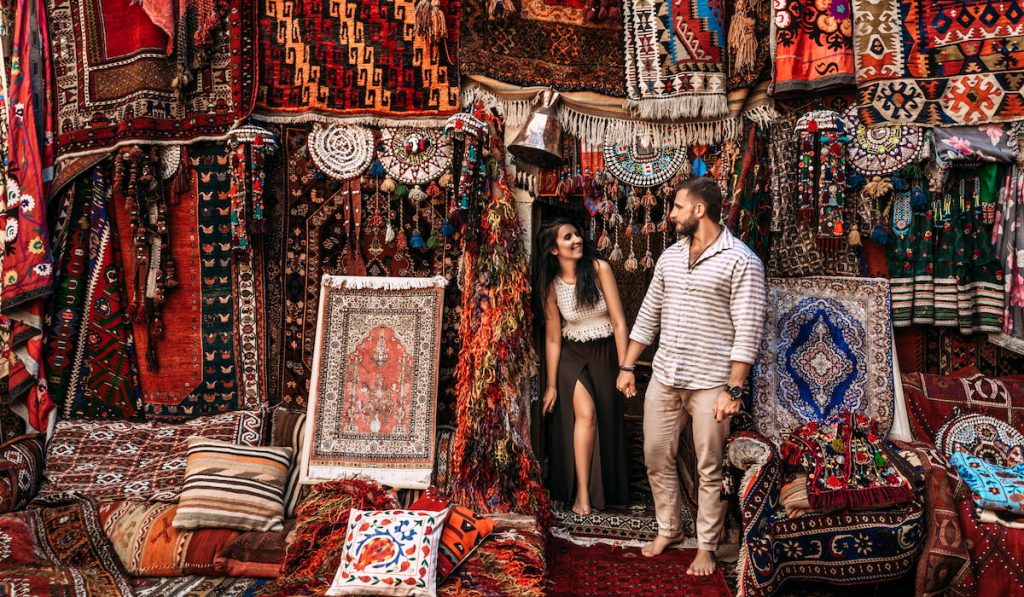 couple in the kilim rug store