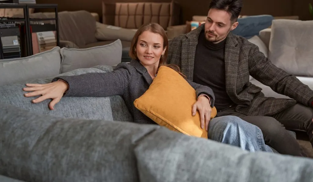 young couple shopping for a sofa