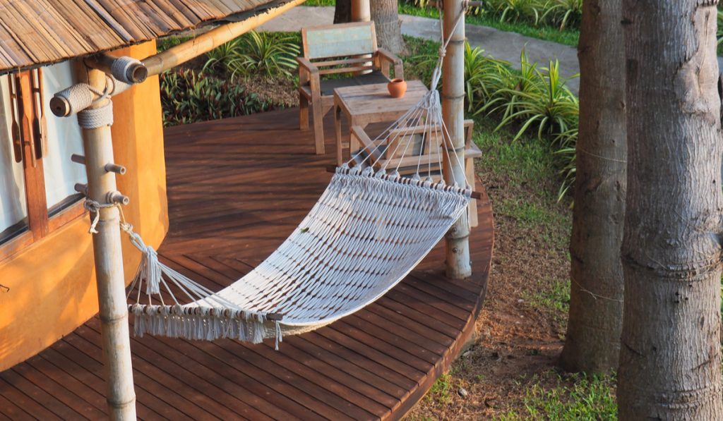 White hammock in front of the house